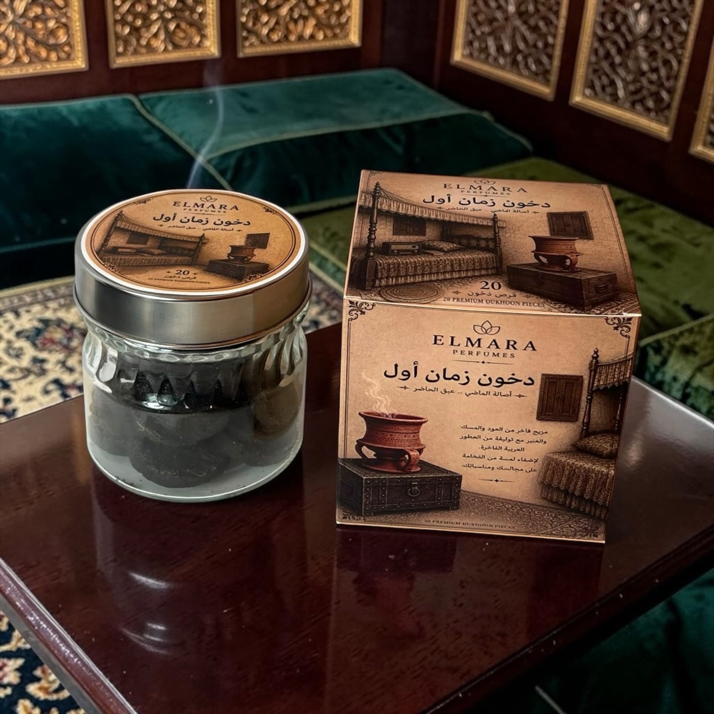 LumaHouse ELMARA PERFUMES Dukhoon incense pieces in a glass jar next to a decorative box on a dark wooden table.