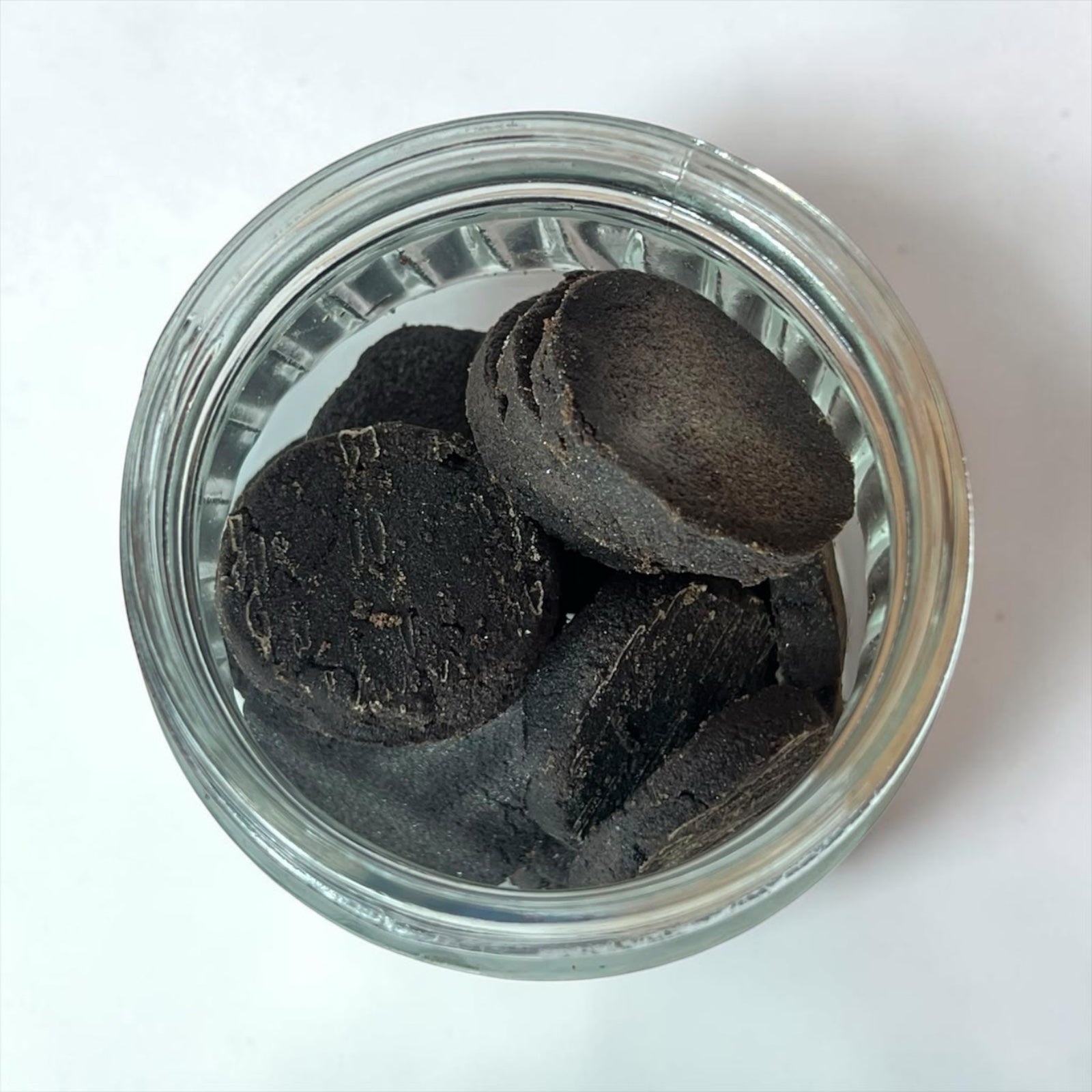 LumaHouse ELMARA PERFUMES premium Dukhoon incense pieces in a glass jar, featuring dark earthy Oud and musk blend.