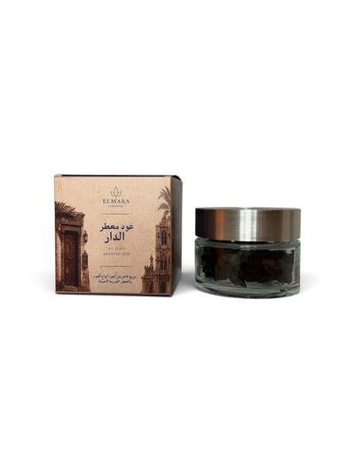 LumaHouse Elmara Perfumes Al Dar scented oud in a 55g glass jar with decorative box featuring Arabian architecture.