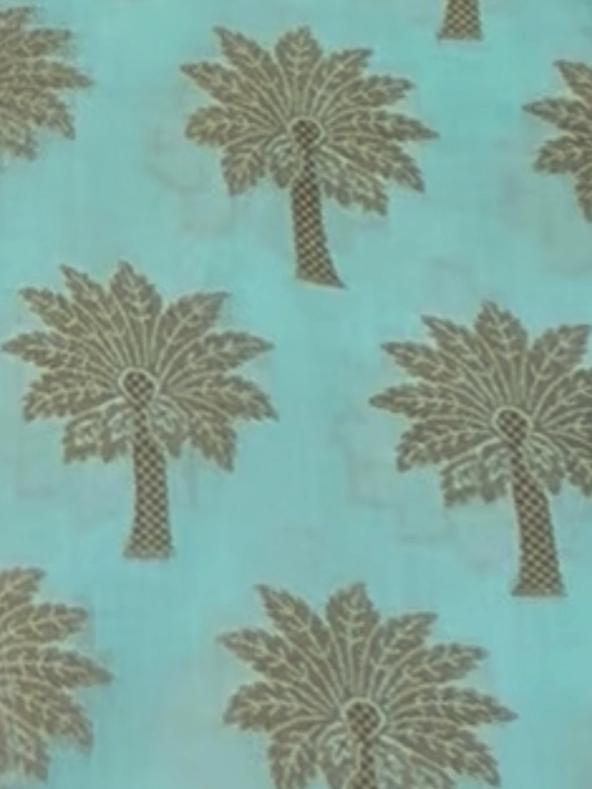 LumaHouse abaya fabric featuring a light blue background with a repeating dark palm tree pattern